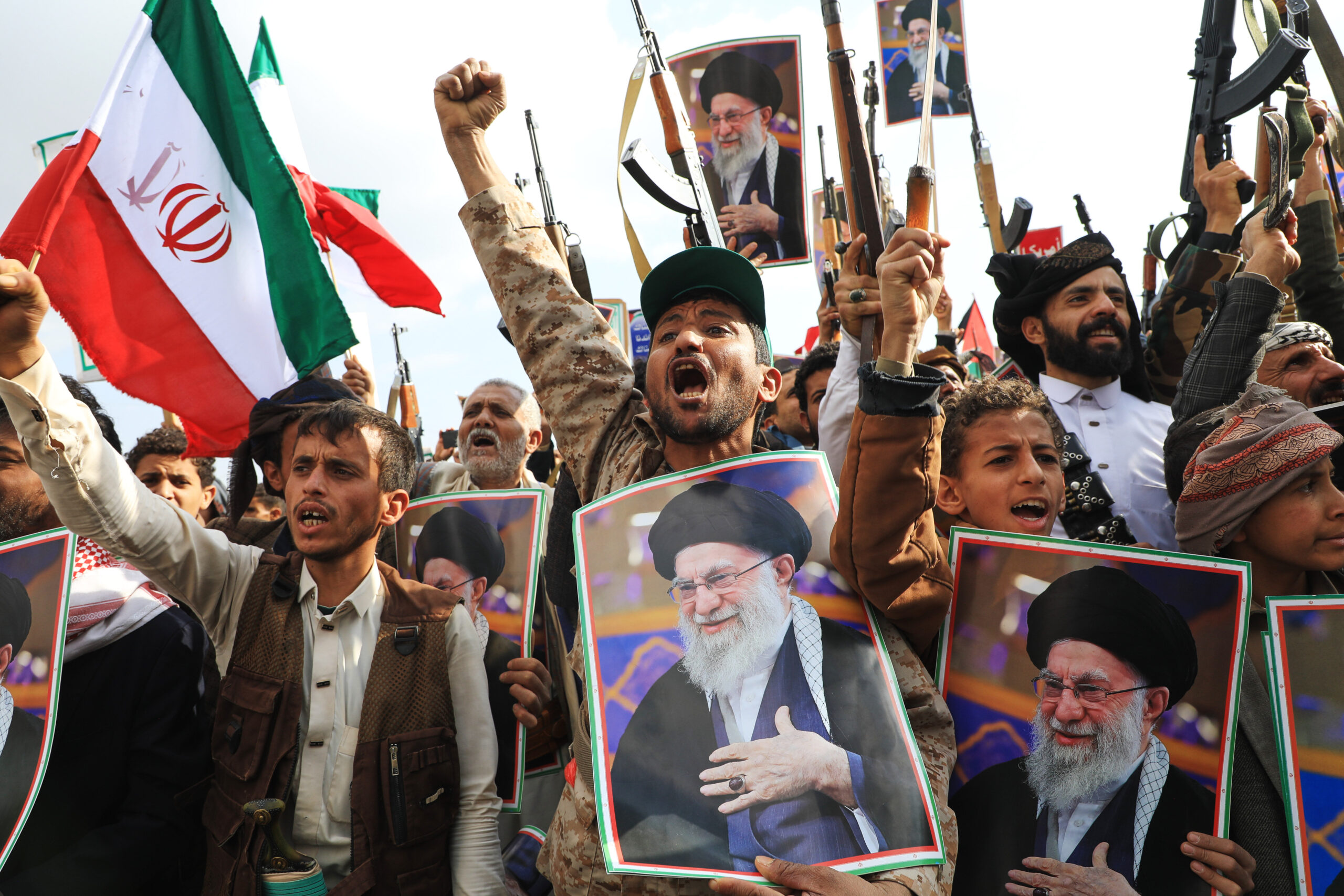 Houthi supporters hold posters of Iranian Supreme Leader Ayatollah Ali Khamenei and Iranian flags during a rally against Israel and the United States in Sanaa, Yemen, Sunday, March 1, 2026. (AP Photo/Osamah Abdulrahman)
